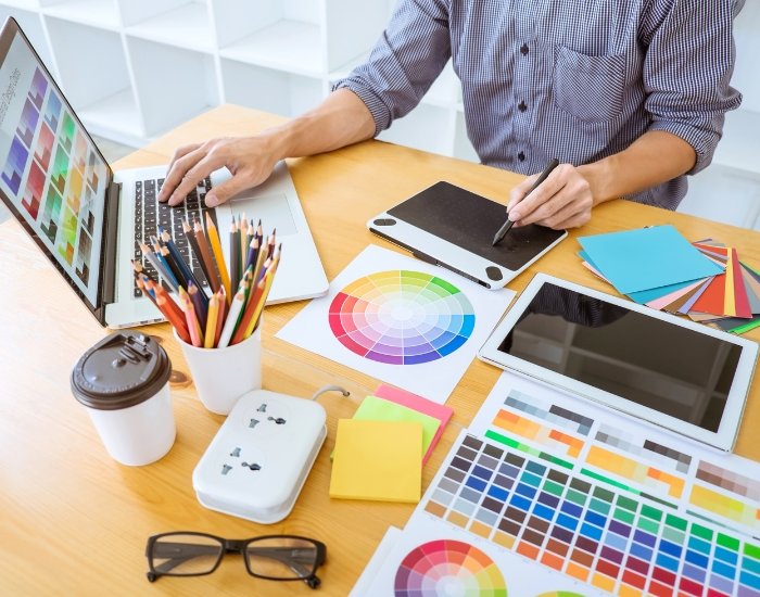 Designers reviewing color swatches and sketches