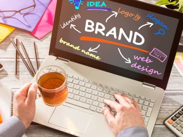 Designer planning a brand and website design on a laptop